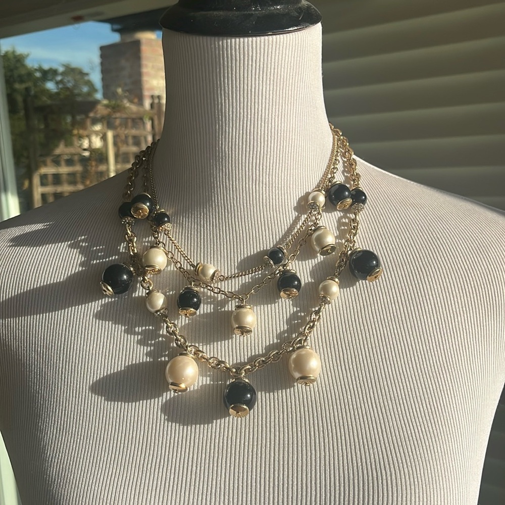 Stunning three strand black white gold necklace